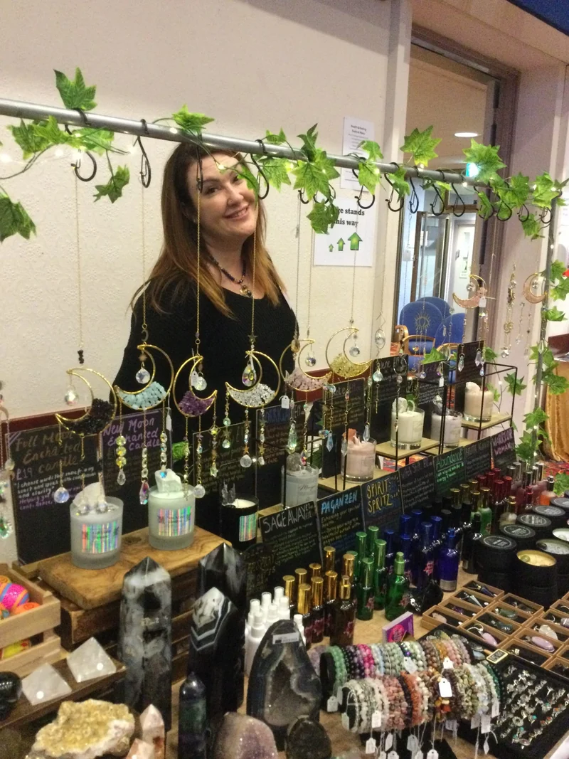 An exhibitor with her wellbeing products