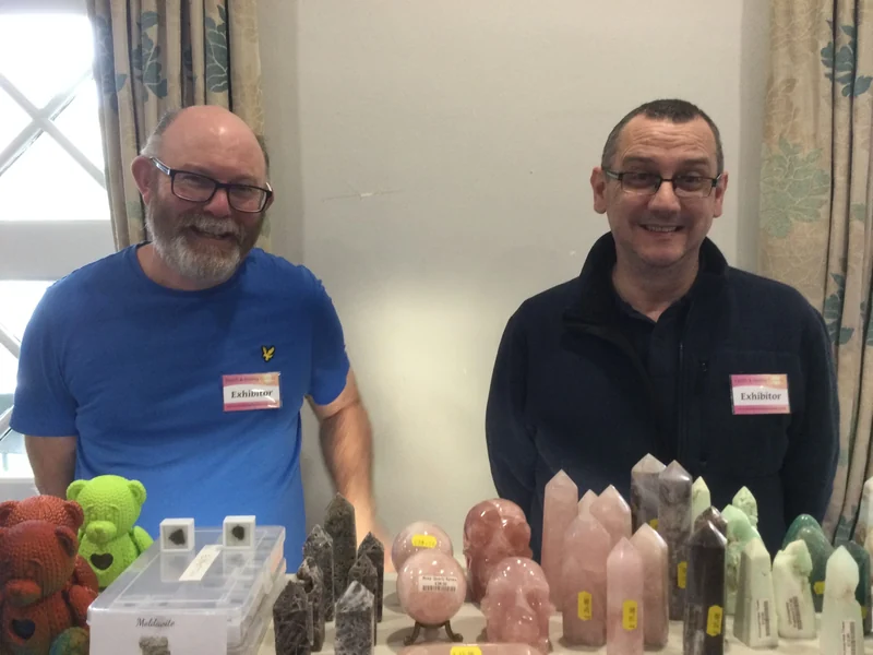 Two exhibitors displaying crystals