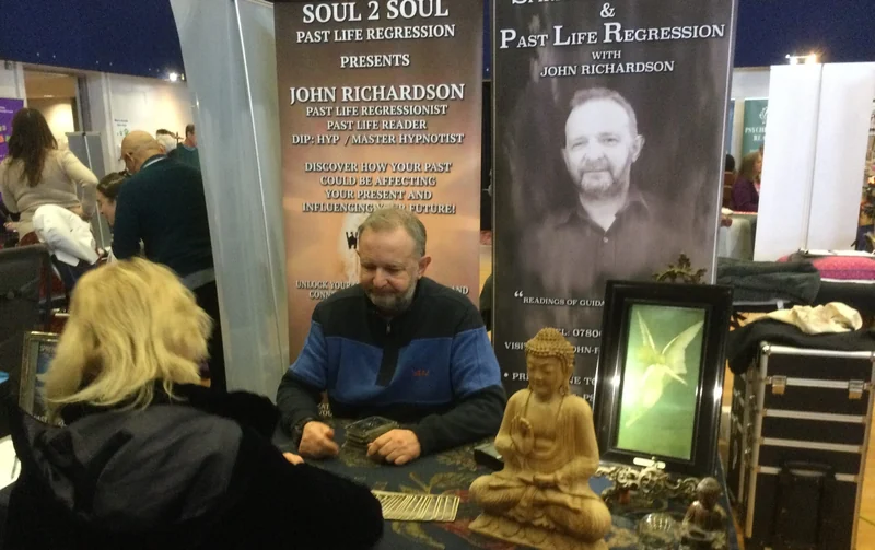 Visitors and exhibitors at a festival stand
