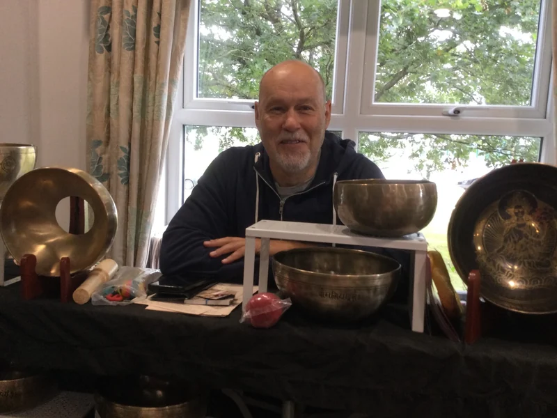 A sound healing exhibitor with singing bowls
