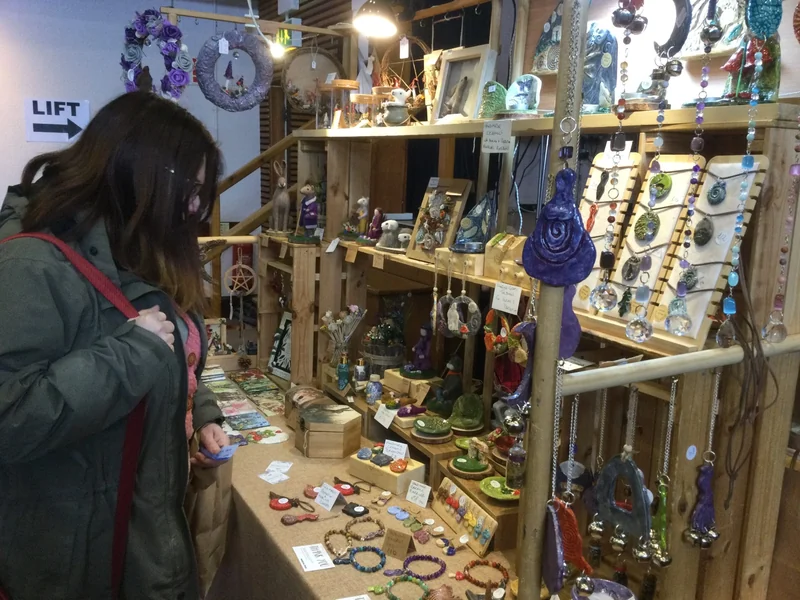 A visitor browsing festival gifts and jewellery